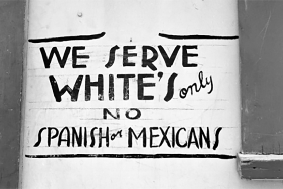 We Serve Whites only sign