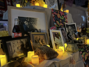 Ofrenda with photos, candles, mementos, food